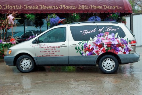 Touch of Love Florist  & Weddings delivery van parked outside the shop